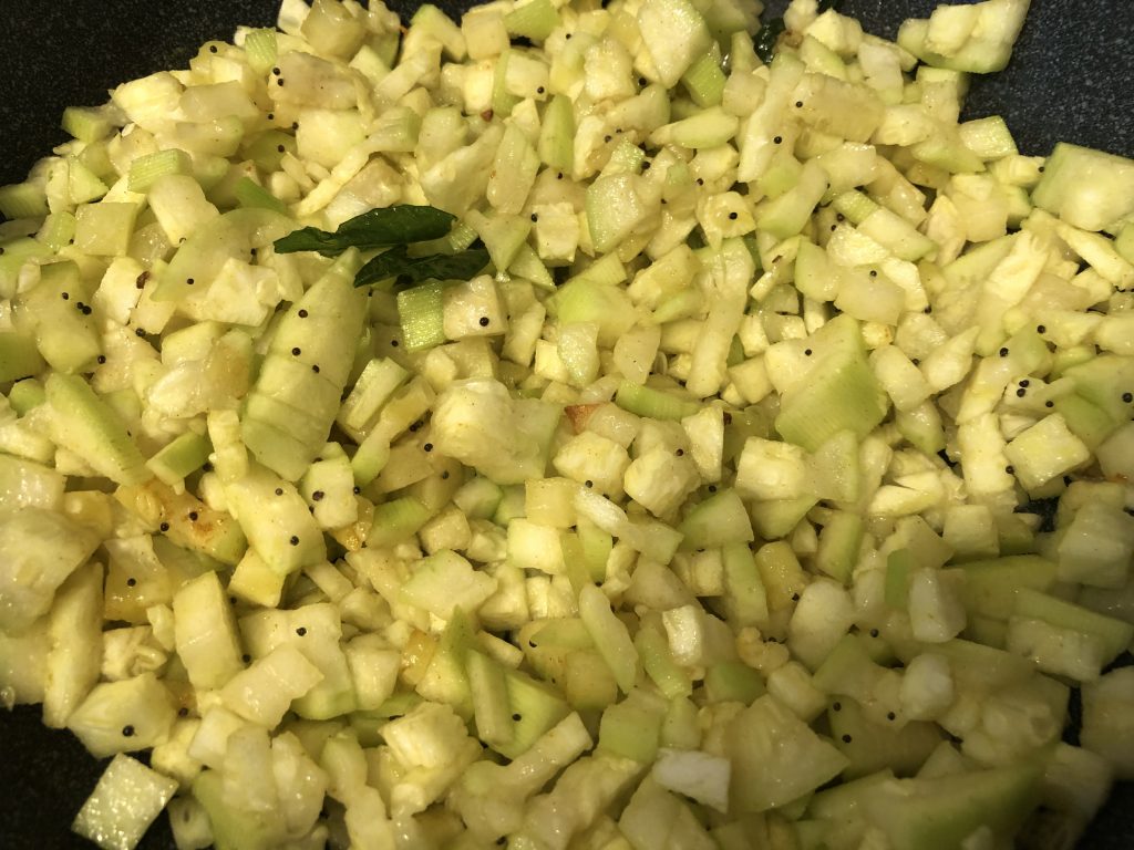 Add chopped lauki to pan and mix