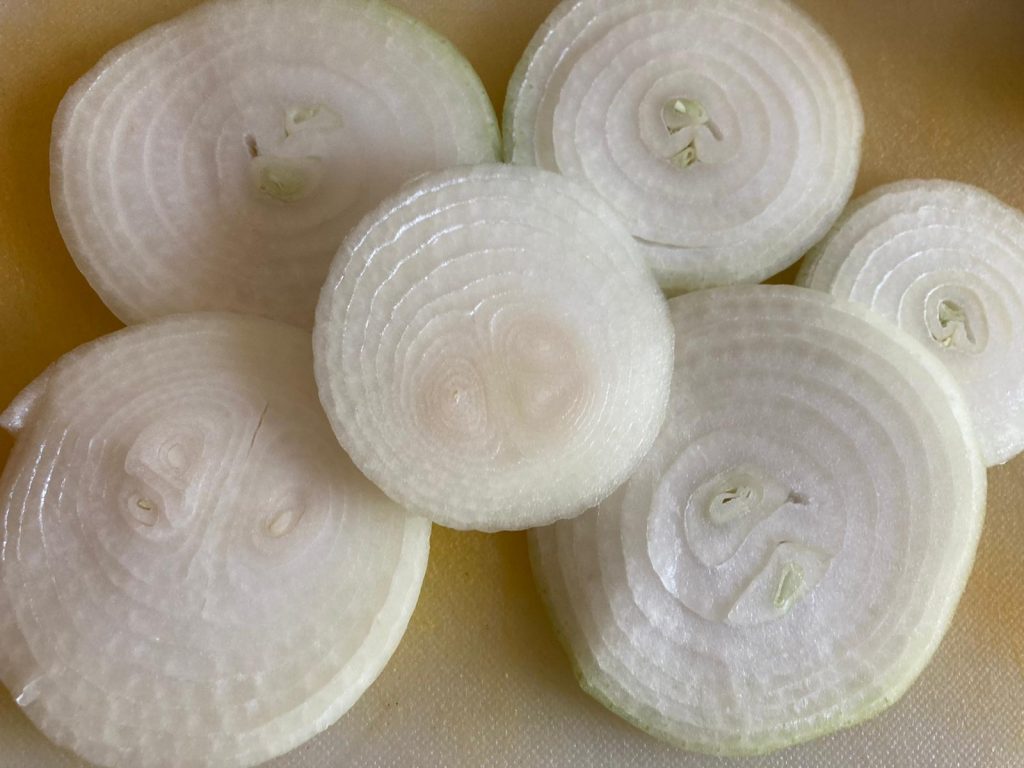 Slice onion for masala pyaaz